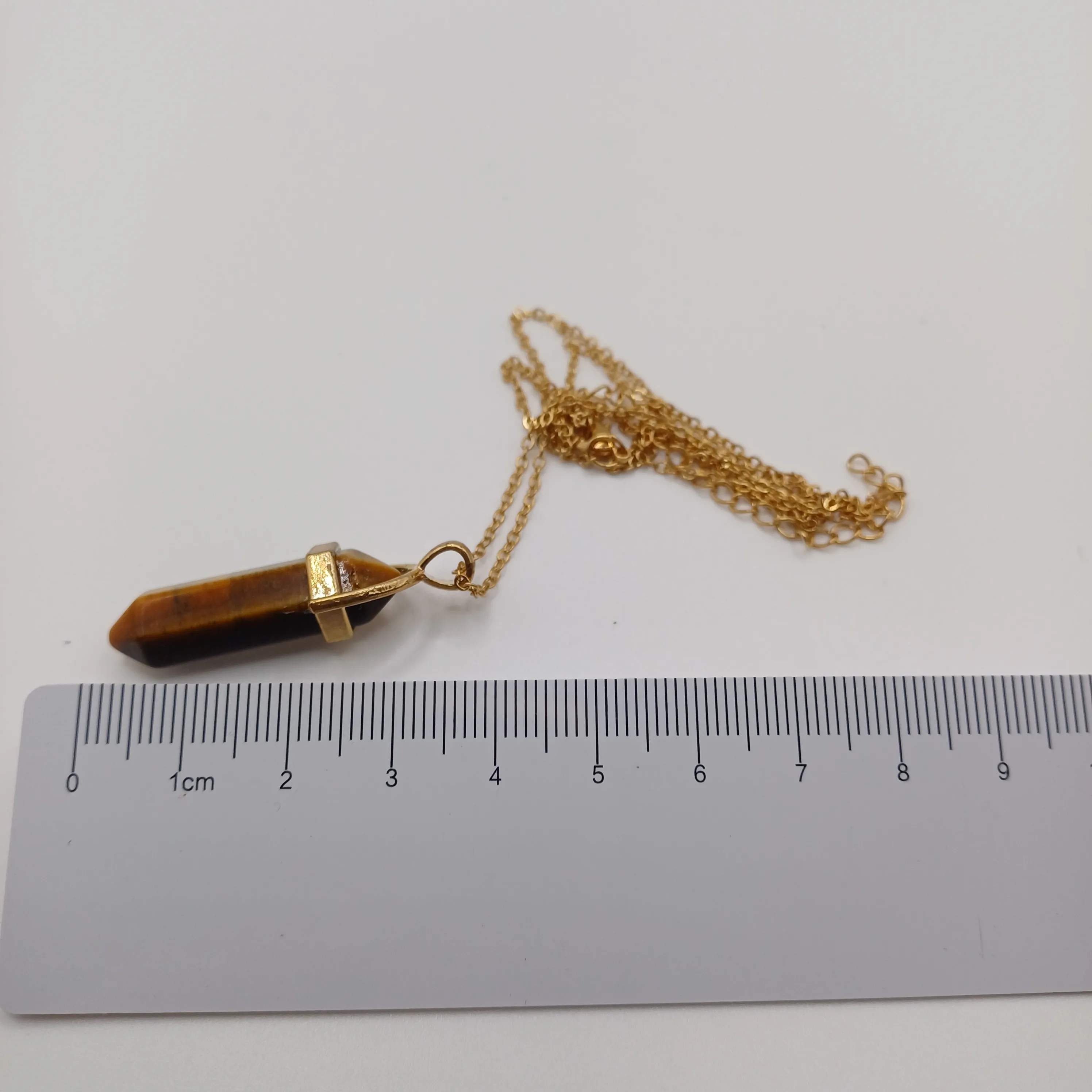 Pendentif fantaisie brun foncé pierre