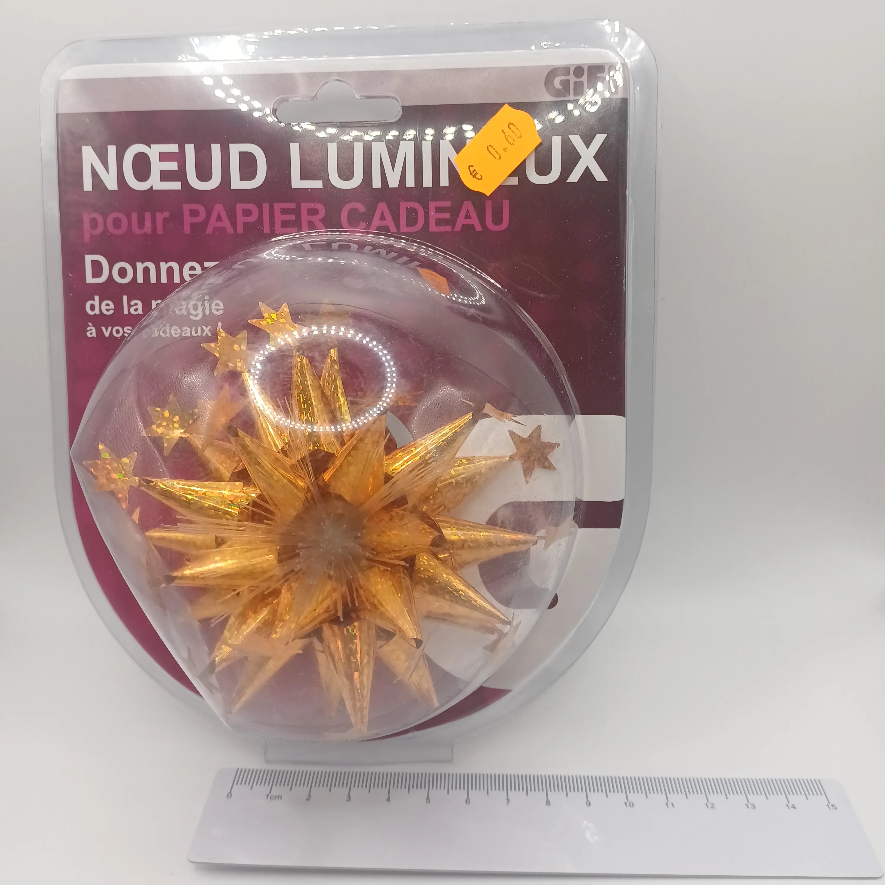 Noeud doré papier cadeau